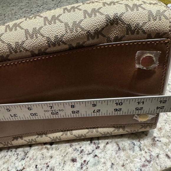NWOT Michael Kors bag no signs of wear. Stickers are still on bottom. - Picture 10 of 12